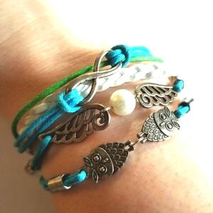 Bracelet with owls, wings, infinity symbol multiple strands blue white
